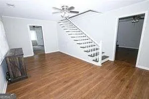 wooden floor in an empty room with a fireplace