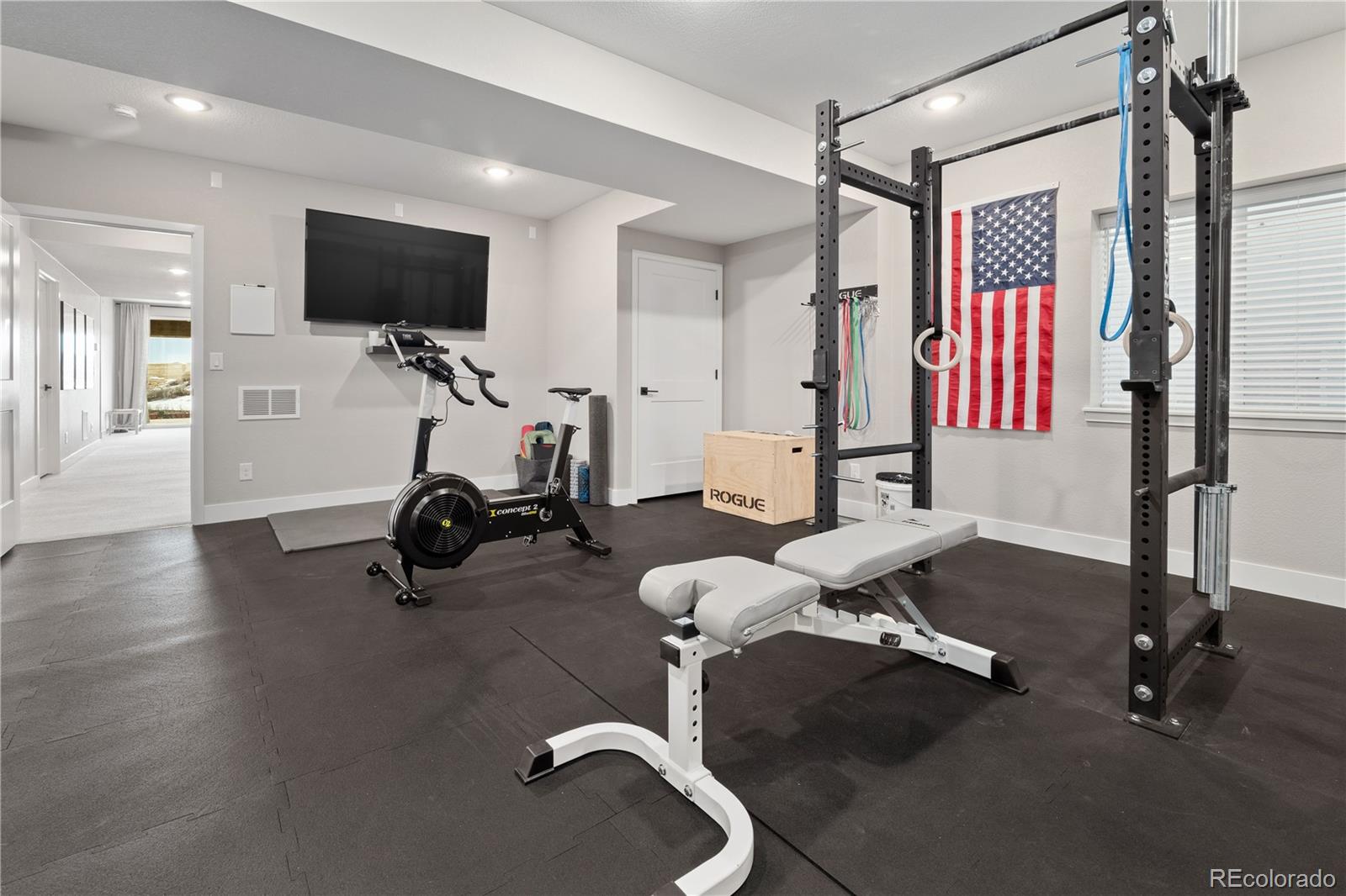 6976 Rim Ridge Drive Castle Pines, CO 80108 - Photo 36 of 50 a view of a room with gym equipment