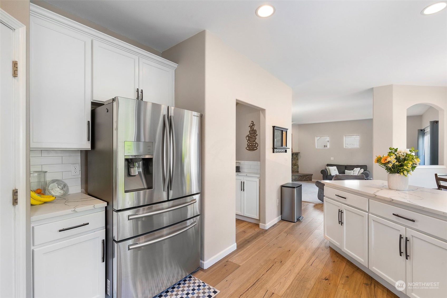 1227 187th Street Southeast Bothell, WA 98012 - Photo 14 of 38 a kitchen with stainless steel appliances a refrigerator sink and white cabinets