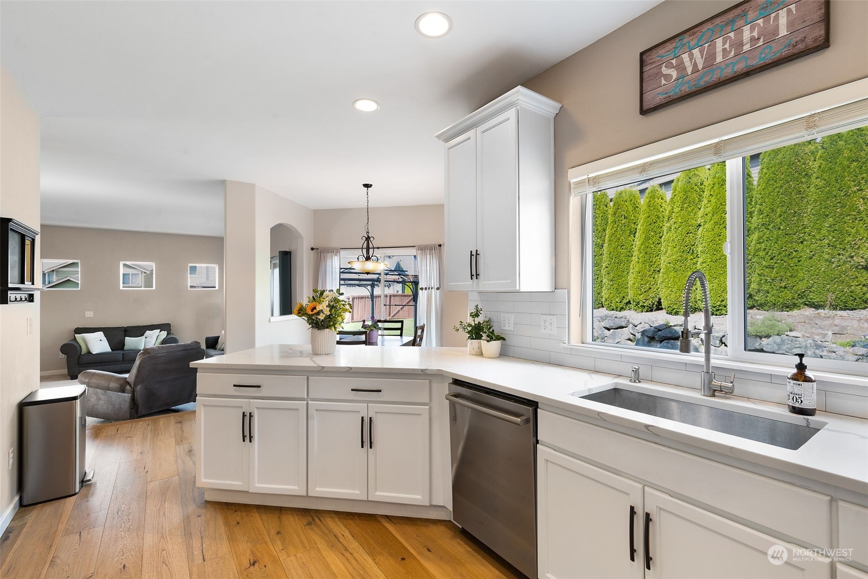 1227 187th Street Southeast Bothell, WA 98012 - Photo 15 of 38 a kitchen with a sink stove and cabinets