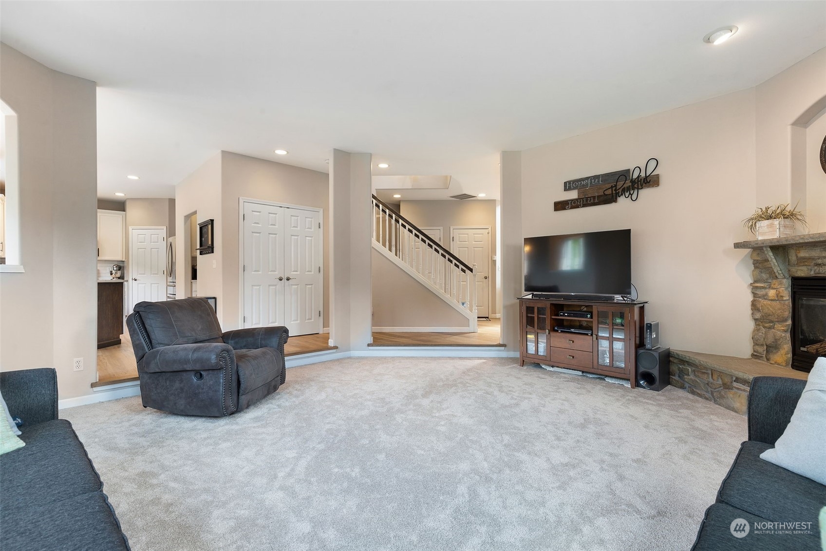 1227 187th Street Southeast Bothell, WA 98012 - Photo 17 of 38 a living room with furniture and a flat screen tv