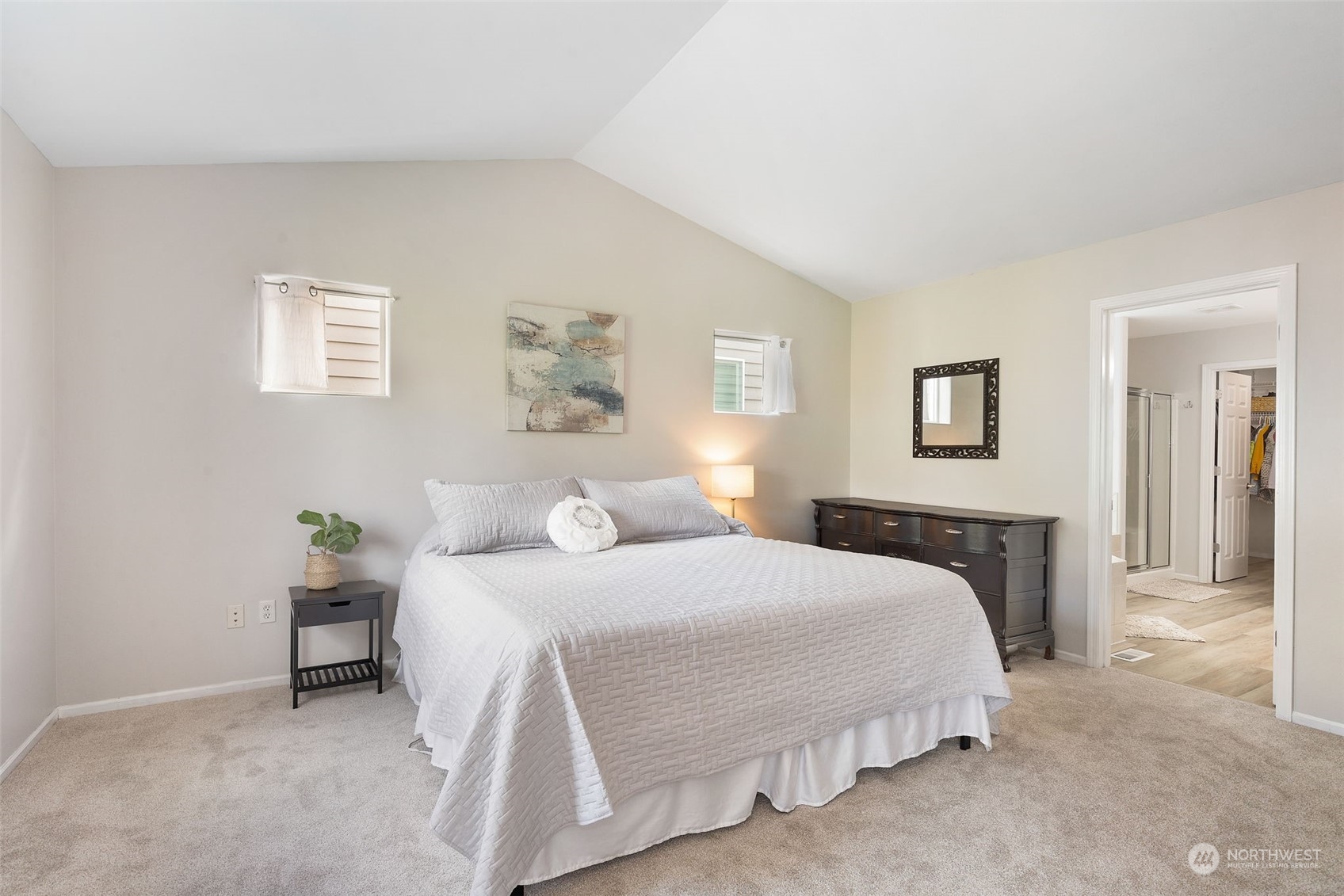 1227 187th Street Southeast Bothell, WA 98012 - Photo 19 of 38 a bedroom with a bed and painting on the wall
