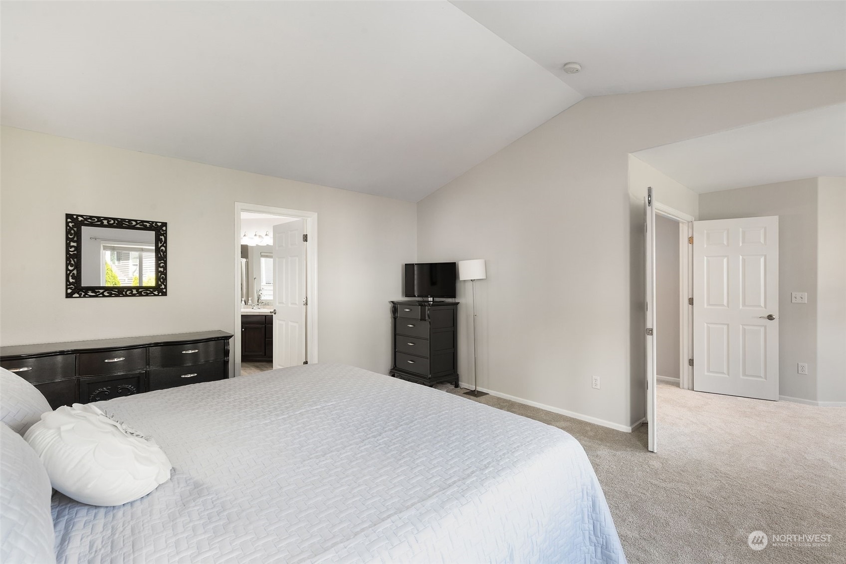 1227 187th Street Southeast Bothell, WA 98012 - Photo 21 of 38 a bedroom with a bed and a large mirror