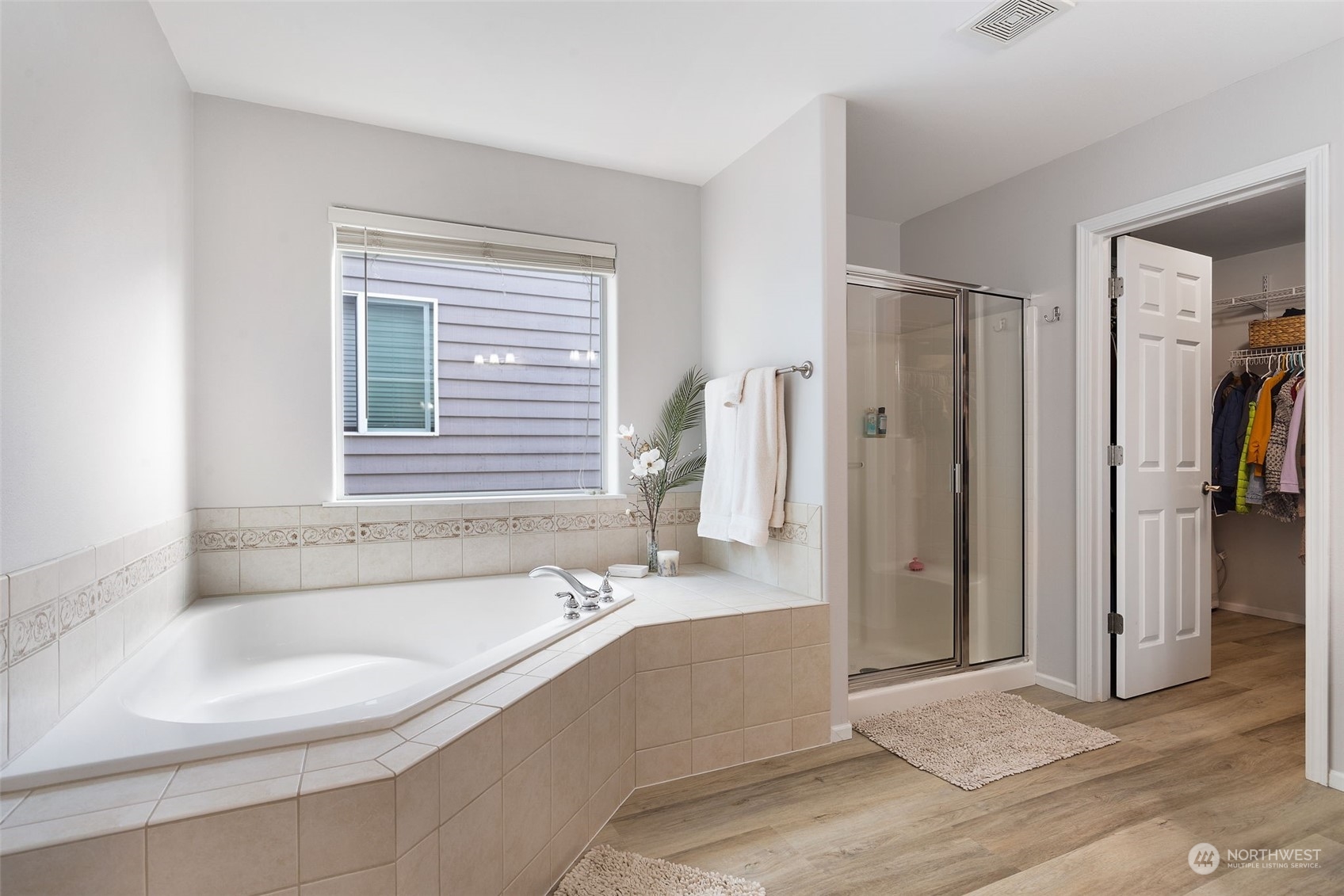 1227 187th Street Southeast Bothell, WA 98012 - Photo 22 of 38 a spacious bathroom with a tub shower and sink