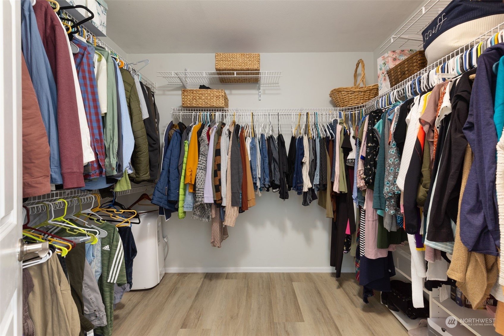 1227 187th Street Southeast Bothell, WA 98012 - Photo 24 of 38 a view of walk in closet with clothes
