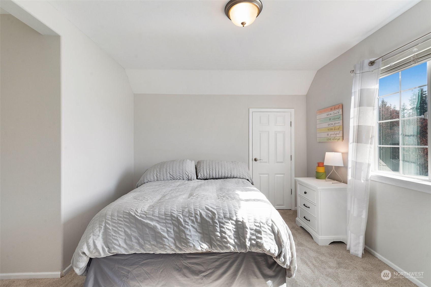 1227 187th Street Southeast Bothell, WA 98012 - Photo 28 of 38 a bedroom with a bed and a window