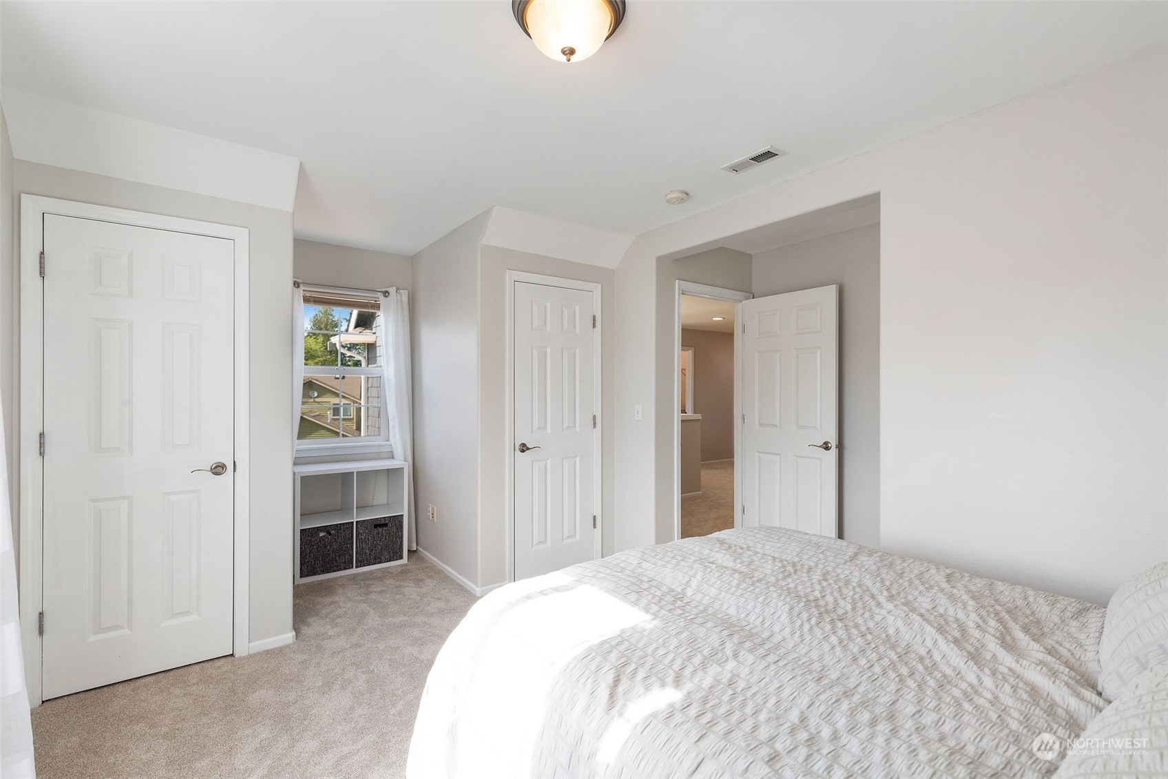 1227 187th Street Southeast Bothell, WA 98012 - Photo 29 of 38 a bedroom with a bed and cabinets