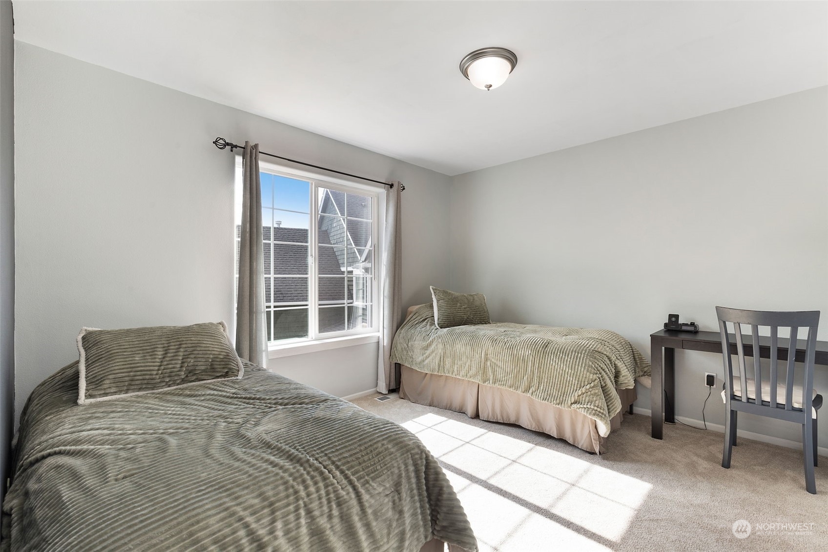 1227 187th Street Southeast Bothell, WA 98012 - Photo 30 of 38 a bedroom with a bed and a window