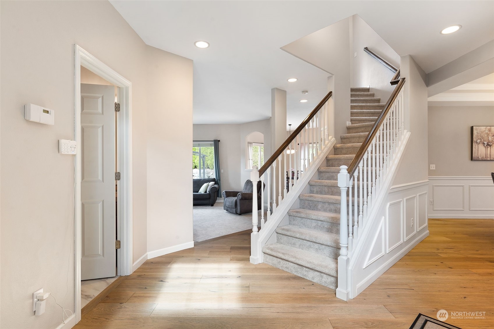 1227 187th Street Southeast Bothell, WA 98012 - Photo 5 of 38 a view of a hallway with staircase and white walls