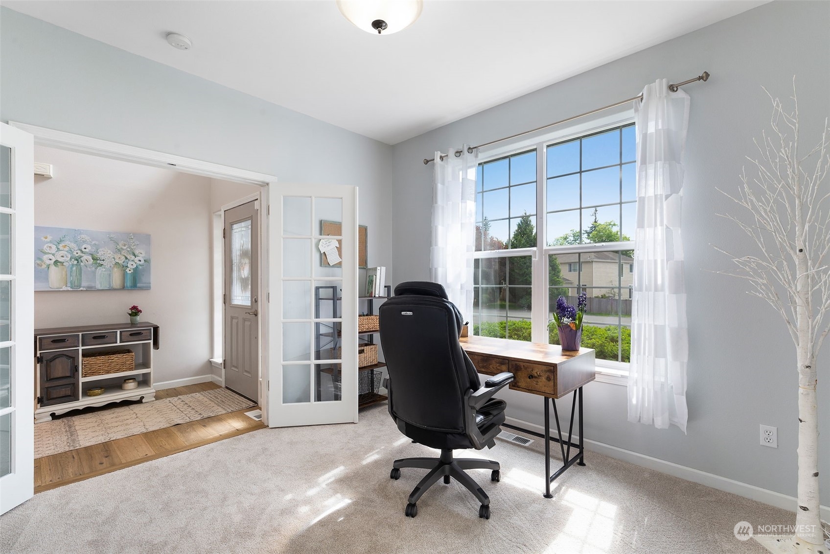 1227 187th Street Southeast Bothell, WA 98012 - Photo 7 of 38 a view of a workspace with furniture and a window