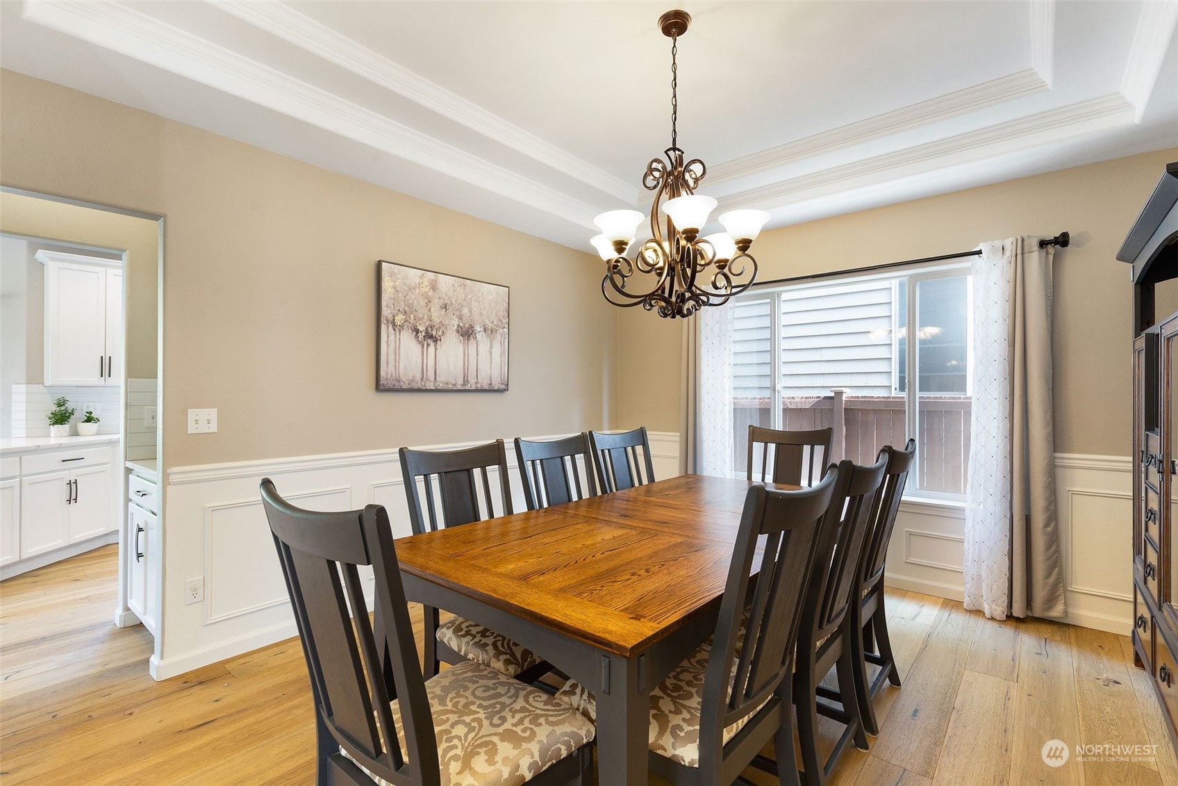 1227 187th Street Southeast Bothell, WA 98012 - Photo 8 of 38 a view of a dining room with furniture window and wooden floor