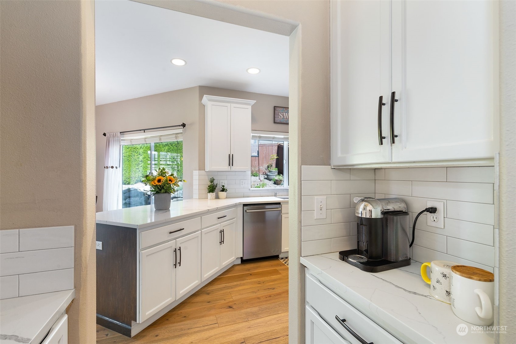 1227 187th Street Southeast Bothell, WA 98012 - Photo 10 of 38 a kitchen with stainless steel appliances granite countertop a sink and cabinets
