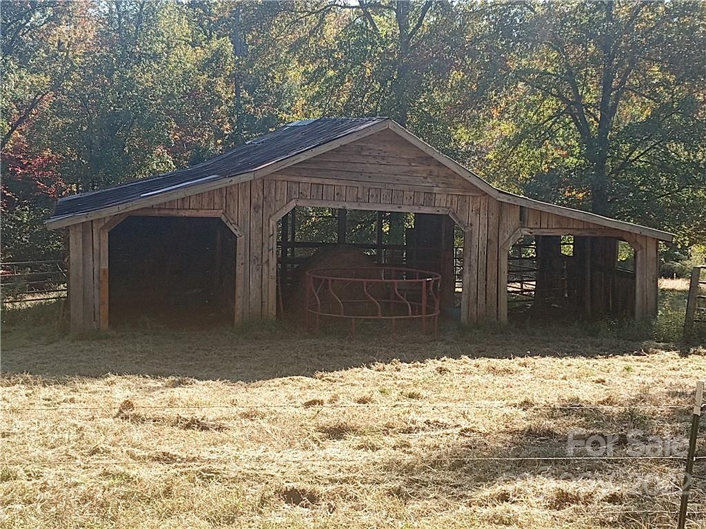 671 Jess Lamb Road Rutherfordton, NC 28139 - Photo 13 of 31 a front view of a house with a yard