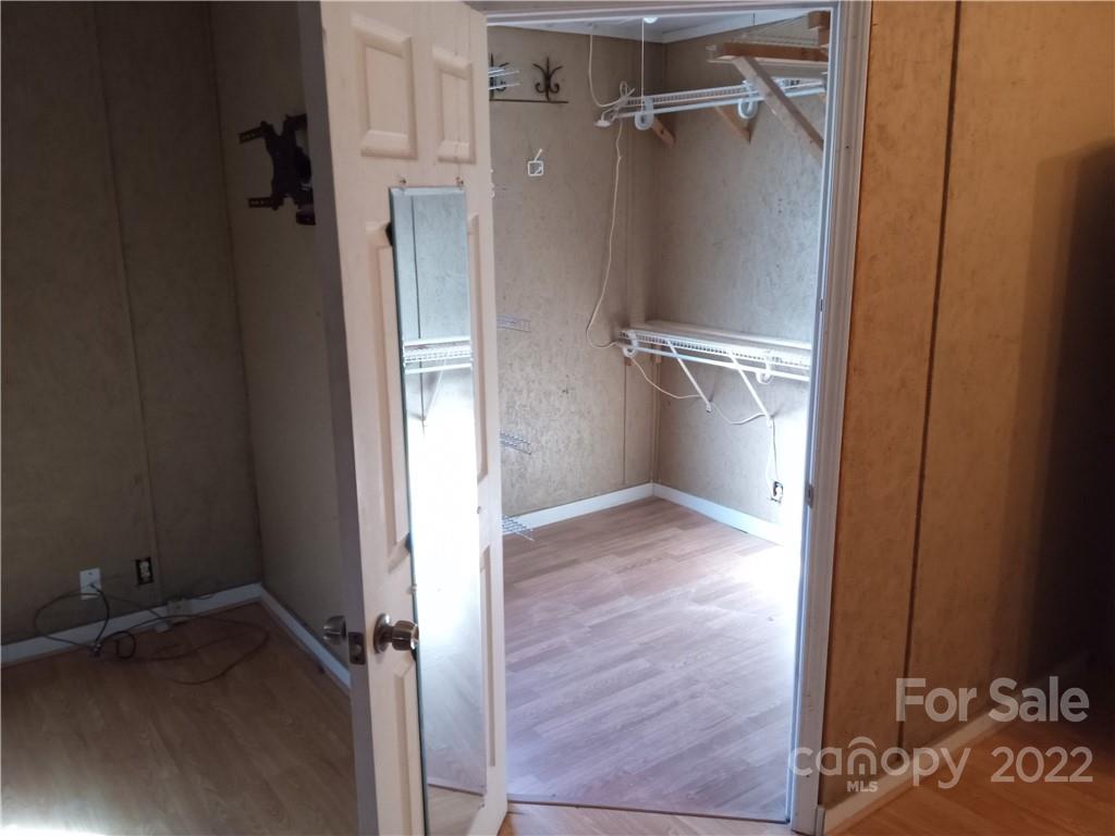671 Jess Lamb Road Rutherfordton, NC 28139 - Photo 15 of 31 a view of a room with wooden floor and a shower