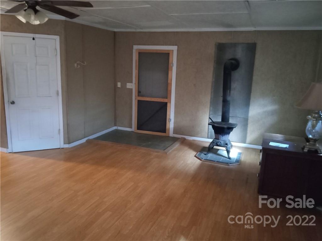 671 Jess Lamb Road Rutherfordton, NC 28139 - Photo 16 of 31 a view of empty room with windows