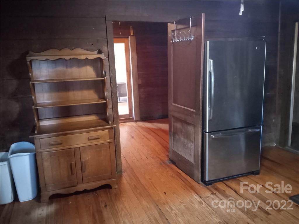 671 Jess Lamb Road Rutherfordton, NC 28139 - Photo 17 of 31 a kitchen with a refrigerator and wooden floor