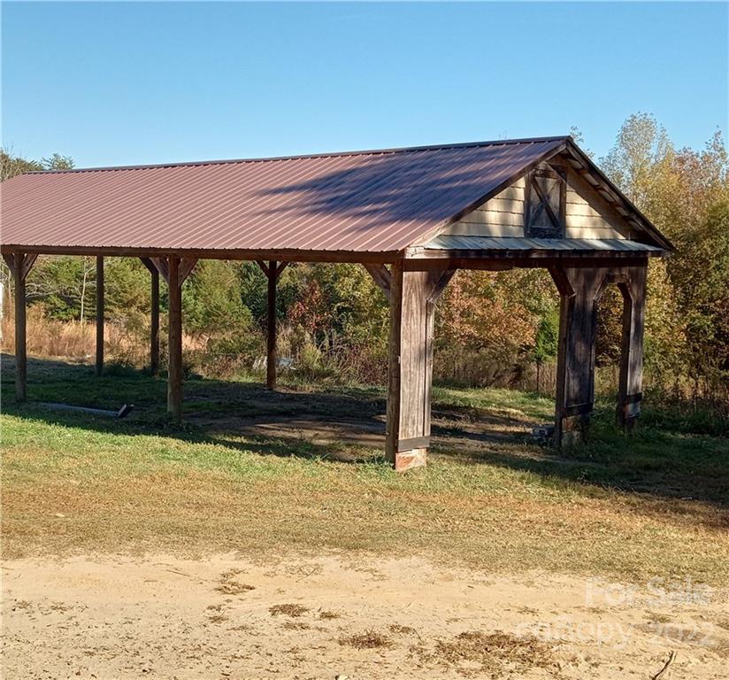 671 Jess Lamb Road Rutherfordton, NC 28139 - Photo 10 of 31 a view of swimming pool with an outdoor space and seating area