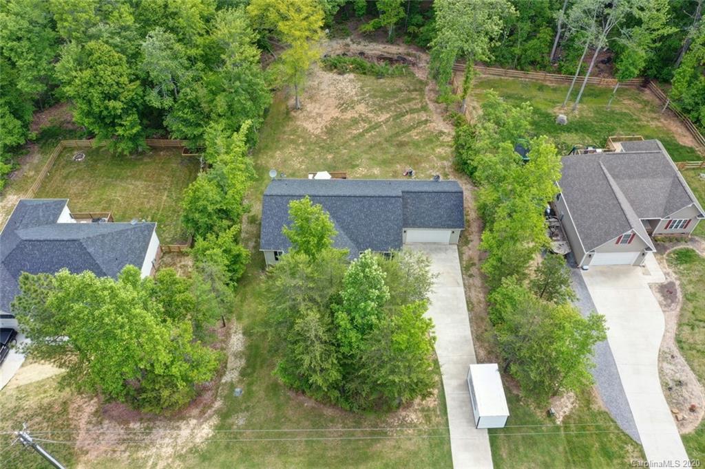 3018 Ranger Road Clover, SC 29710 - Photo 6 of 31 an aerial view of a house with pool lake view and trees in the background