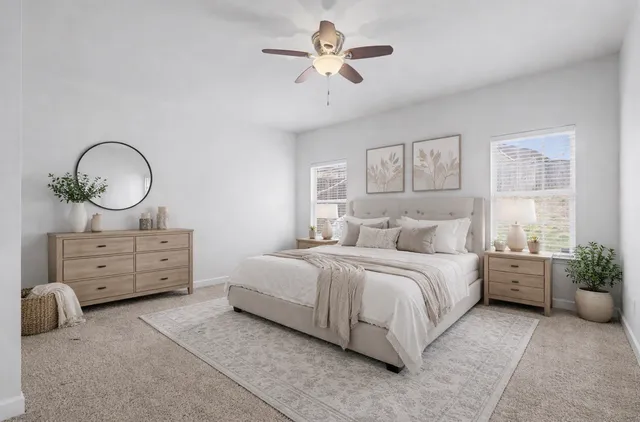 a bed room with bed and a chandelier