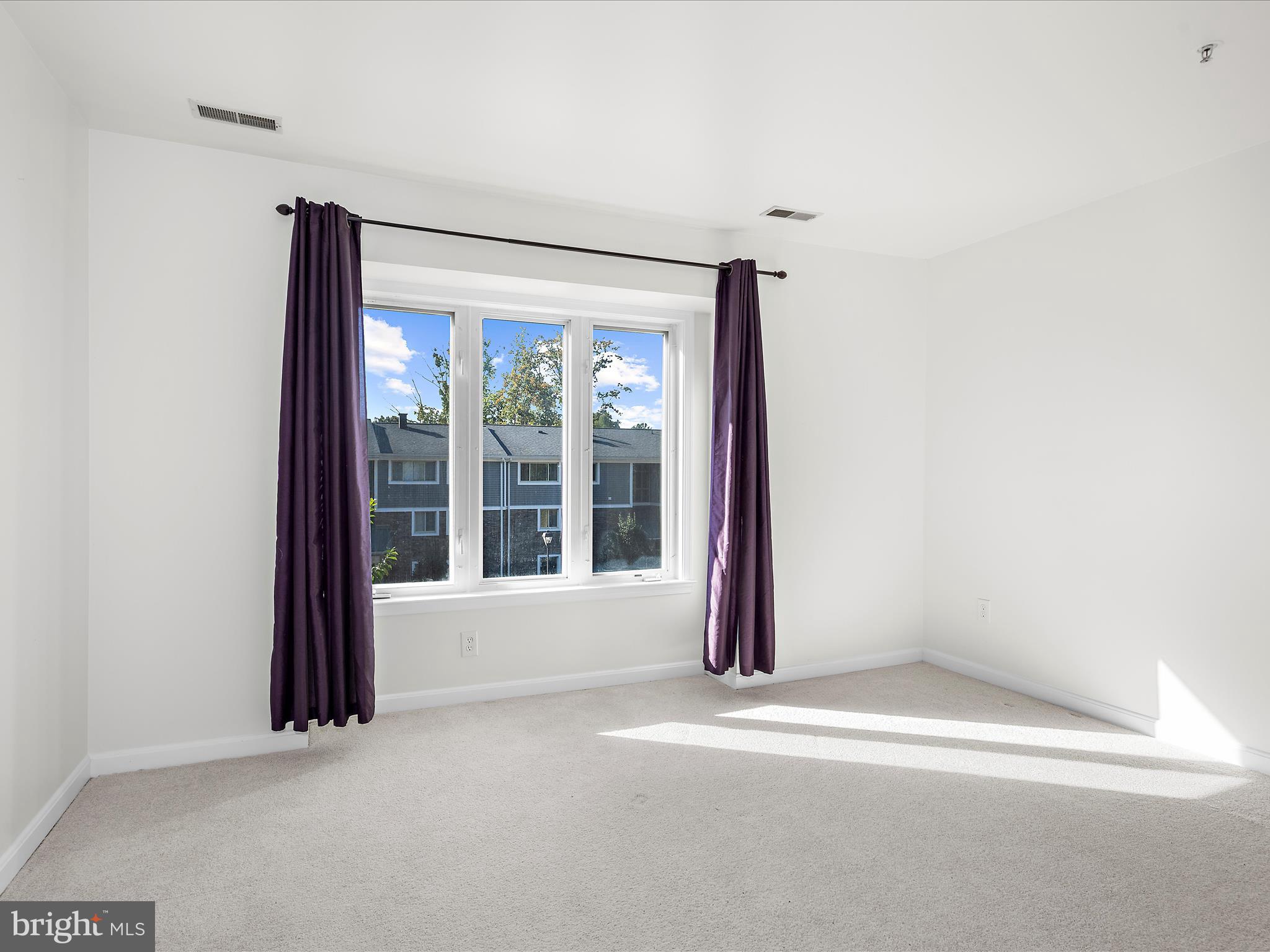 599 Oakland Hills Drive, Unit 3A Arnold, MD 21012 - Photo 13 of 31 a view of an empty room with a window