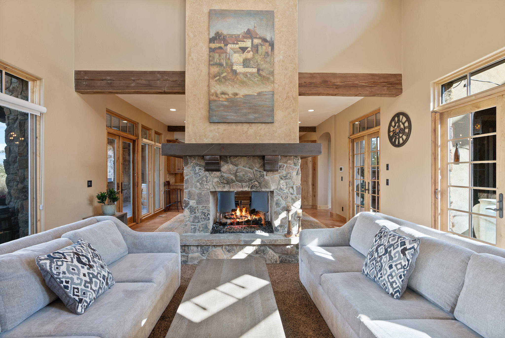22887 Ghost Tree Lane Bend, OR 97701 - Photo 24 of 97 The great room enjoys soaring 16 foot ceilings adorned with solid wood beams and a double sided, natural stone fireplace.