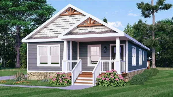 a front view of a house with a yard and potted plants