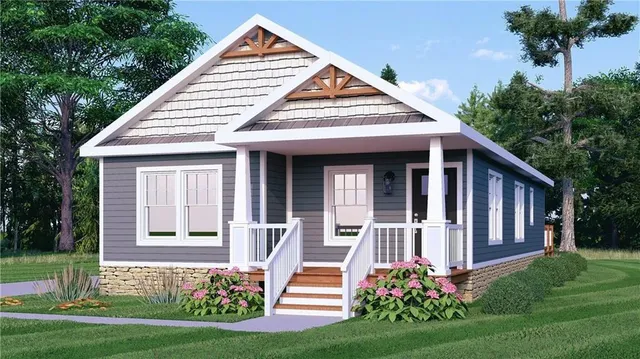 a front view of a house with a yard and potted plants