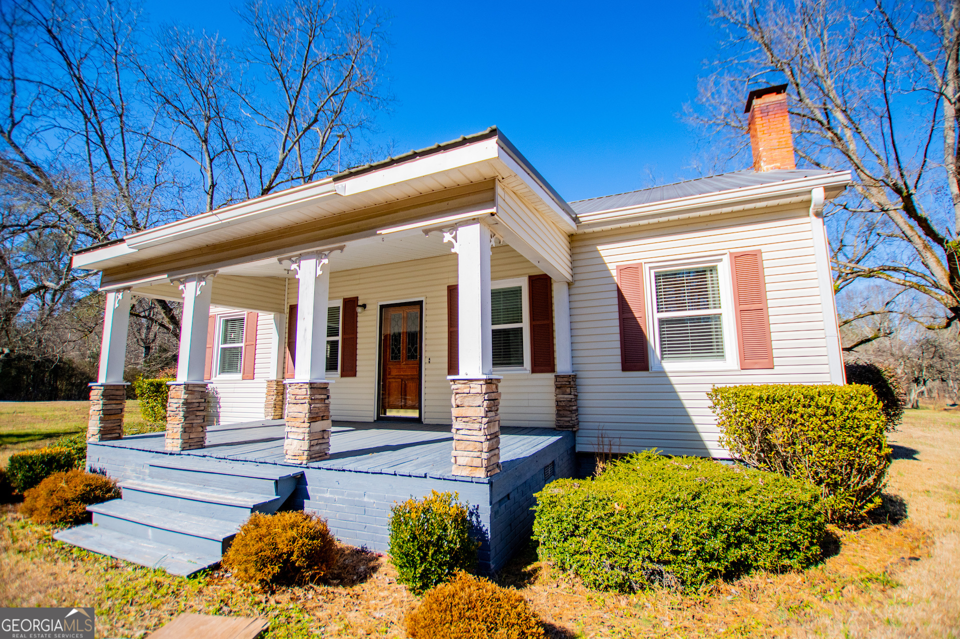 1405 Burwell Road Carrollton, GA 30117 - Photo 1 of 102 a view of a house with a chairs in patio
