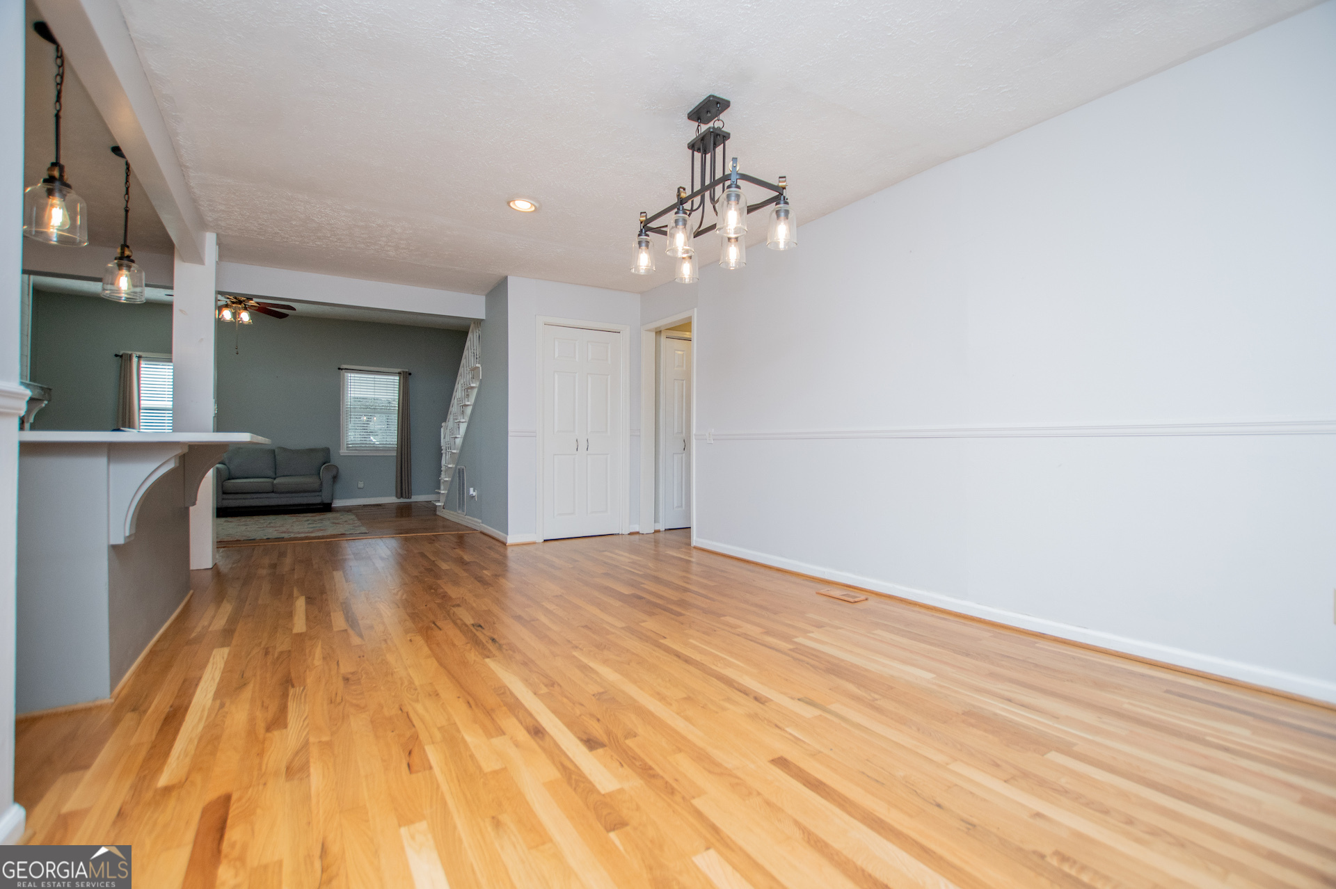 1405 Burwell Road Carrollton, GA 30117 - Photo 13 of 102 a view of a room with wooden floor and ceiling fan