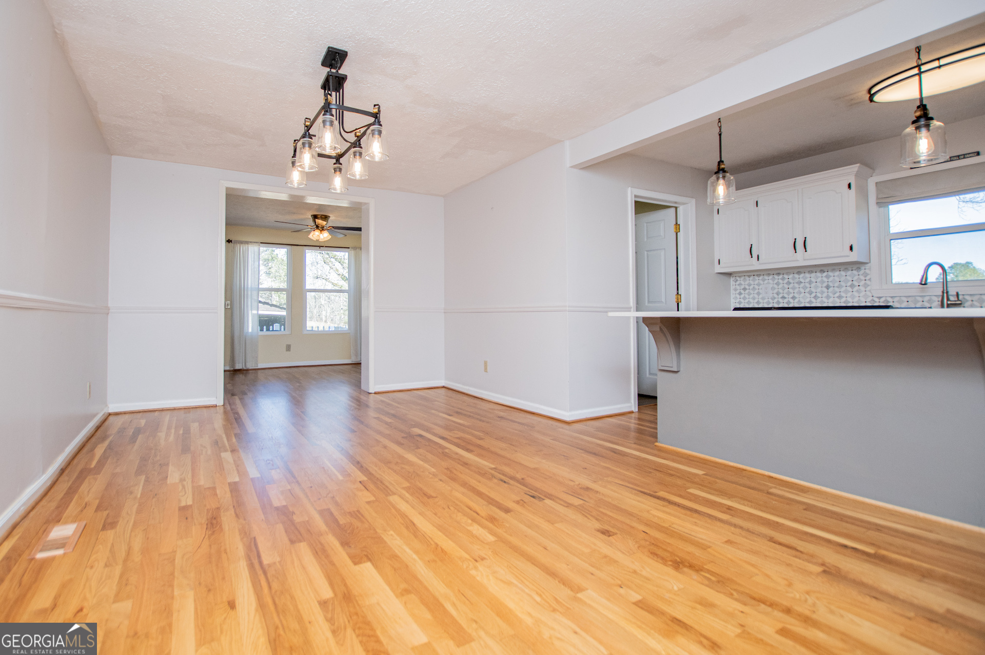 1405 Burwell Road Carrollton, GA 30117 - Photo 16 of 102 a view of a kitchen with wooden floor and cabinets