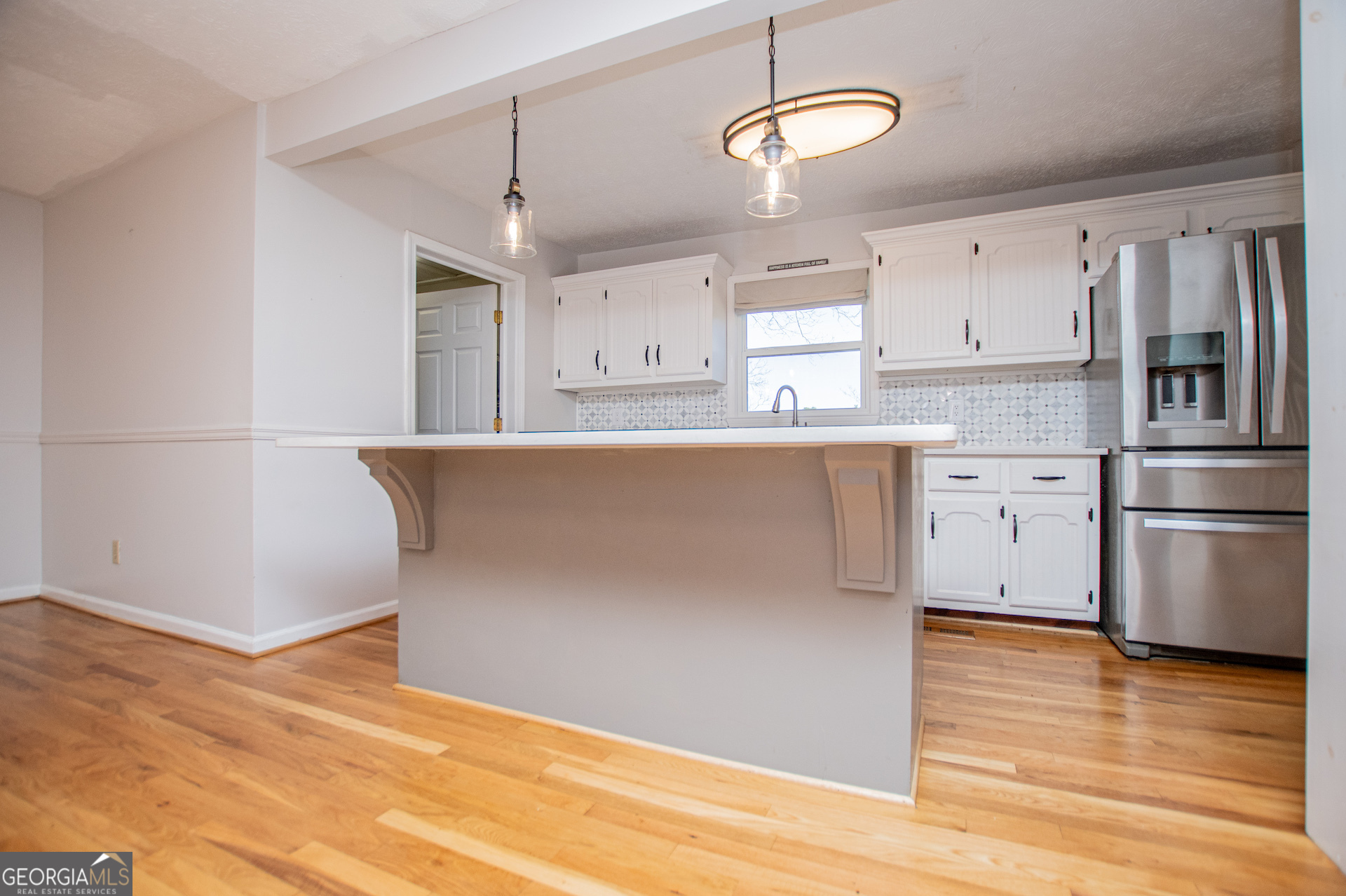 1405 Burwell Road Carrollton, GA 30117 - Photo 19 of 102 a kitchen with stainless steel appliances granite countertop a stove a refrigerator and a microwave