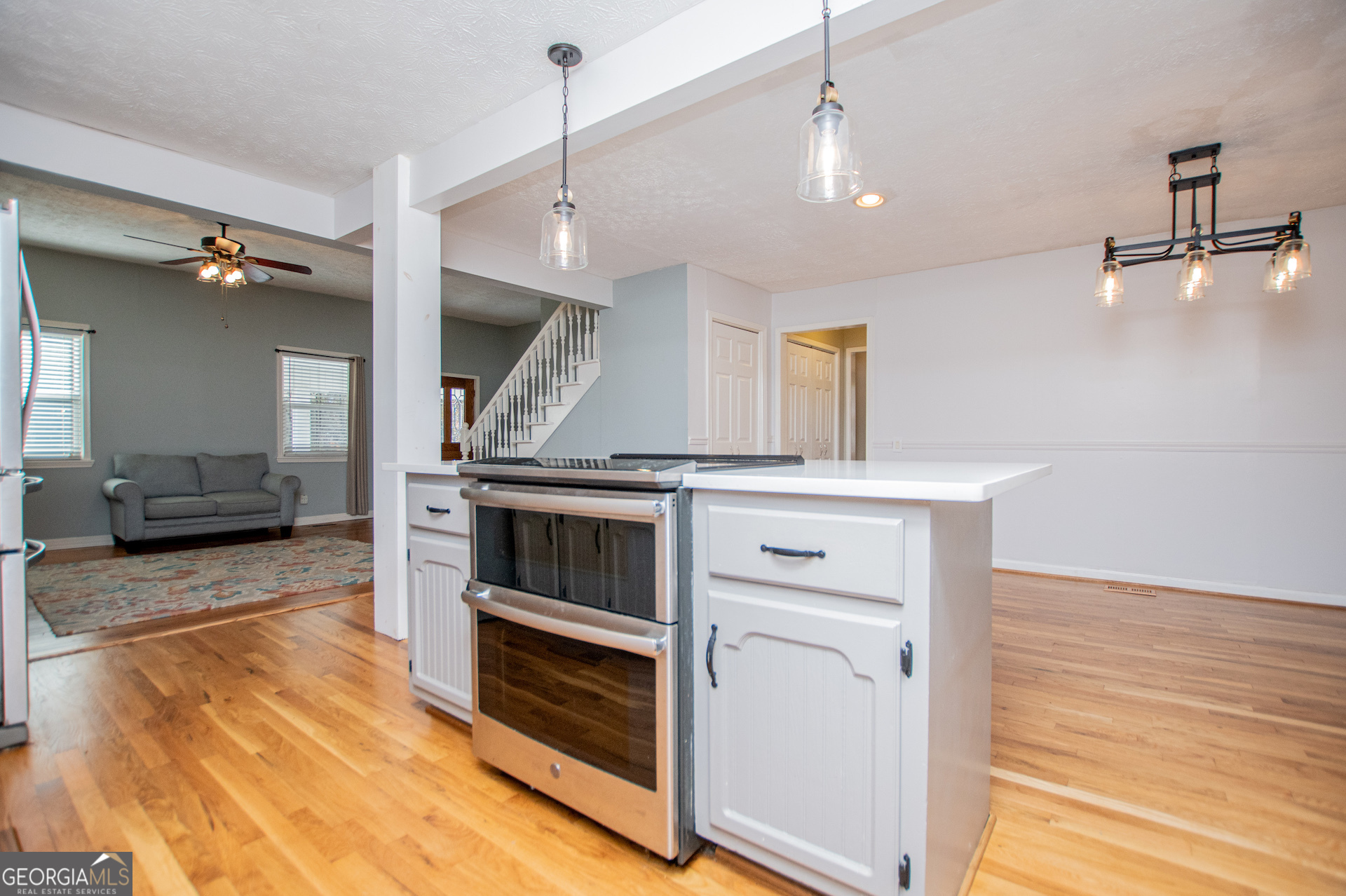 1405 Burwell Road Carrollton, GA 30117 - Photo 21 of 102 a kitchen with stainless steel appliances granite countertop a stove and a sink