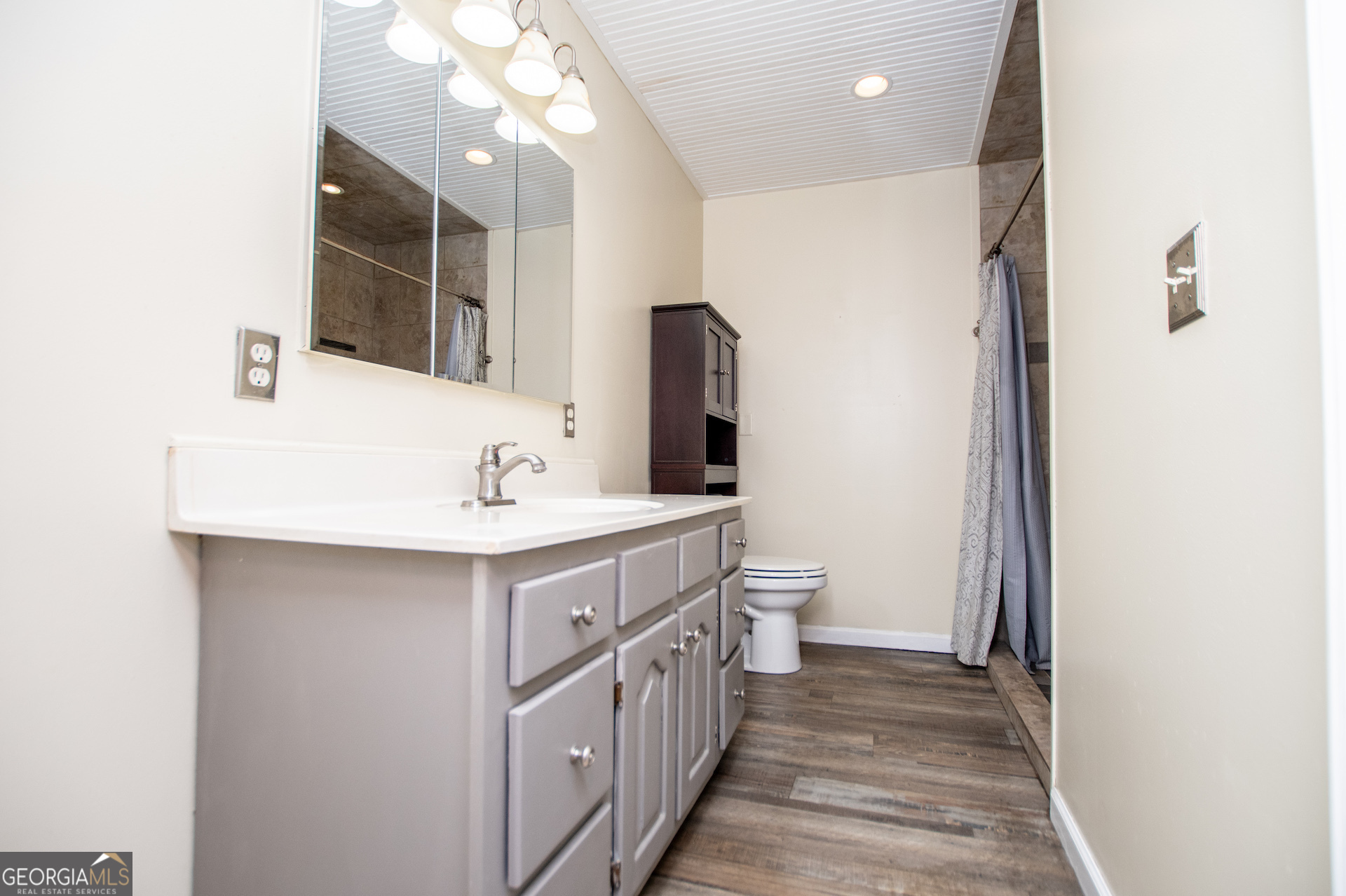 1405 Burwell Road Carrollton, GA 30117 - Photo 34 of 102 a bathroom with a double vanity sink and a mirror