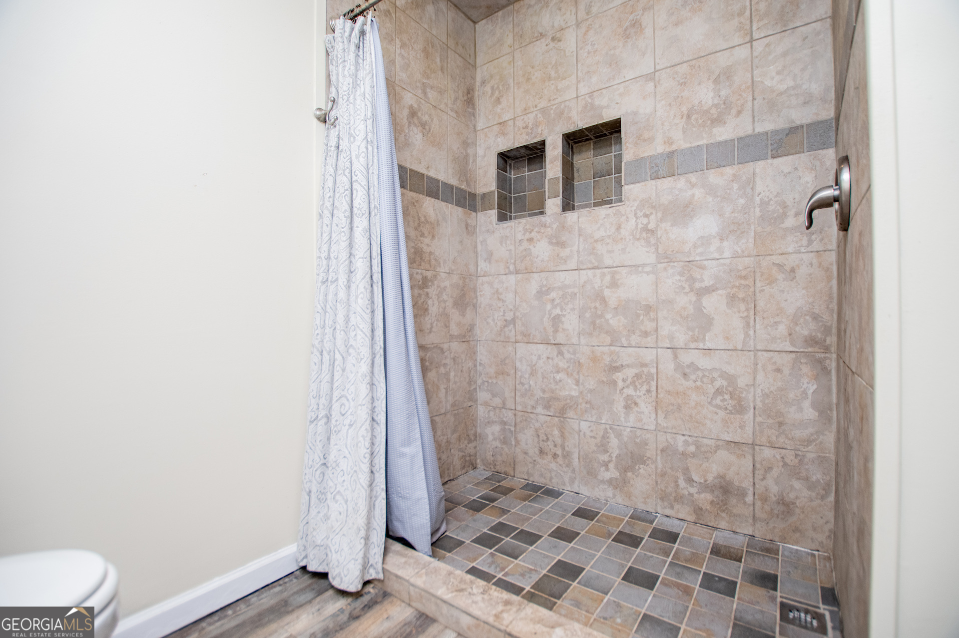 1405 Burwell Road Carrollton, GA 30117 - Photo 36 of 102 a bathroom with a sink and a toilet