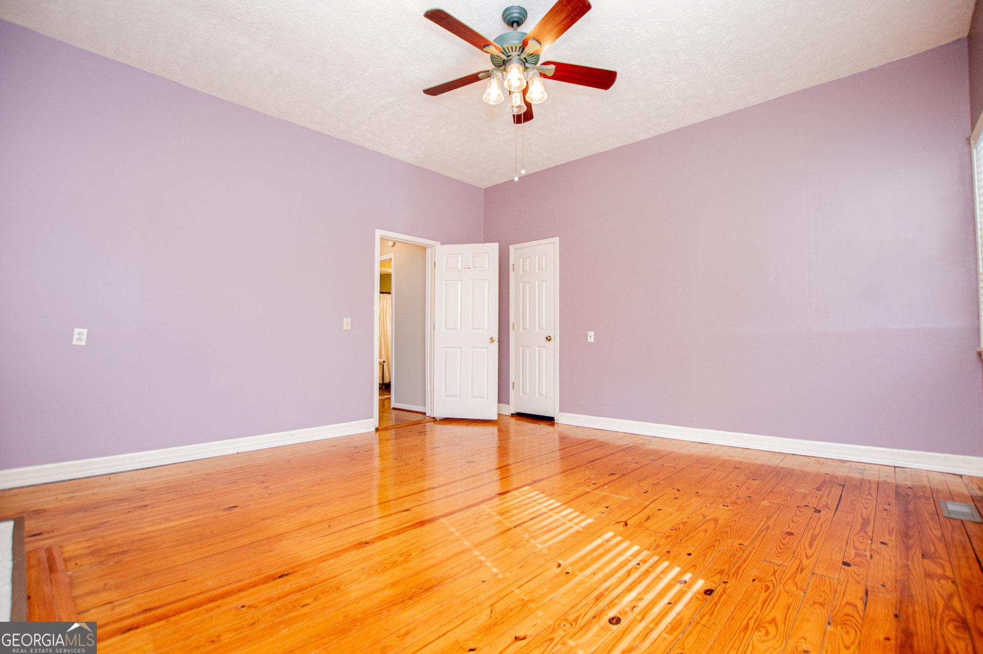 1405 Burwell Road Carrollton, GA 30117 - Photo 37 of 102 a view of an empty room with window and a ceiling fan
