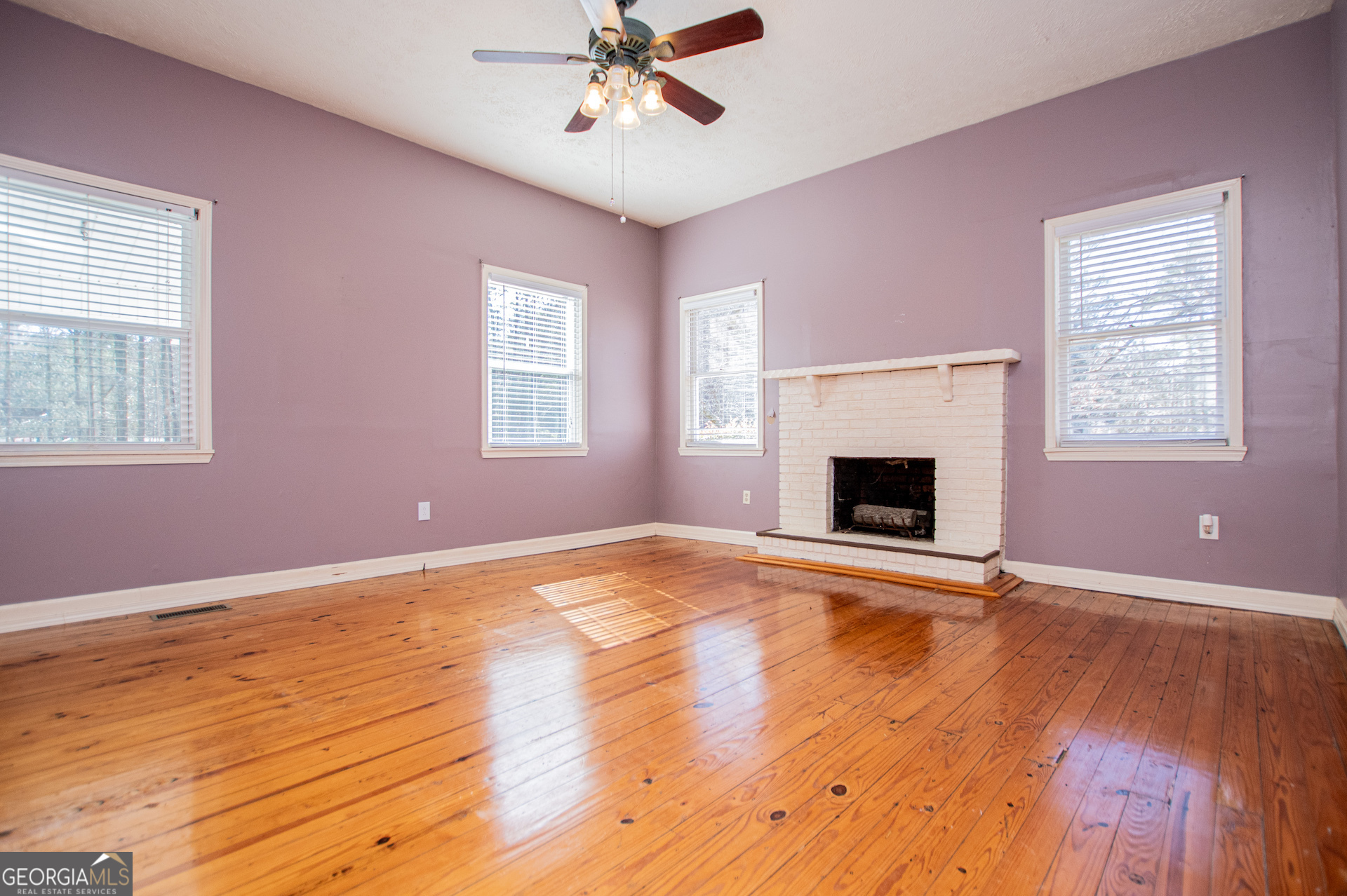 1405 Burwell Road Carrollton, GA 30117 - Photo 38 of 102 a view of an empty room with wooden floor and a window