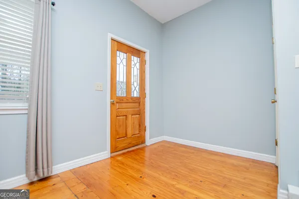 a bedroom with a bed and a fireplace