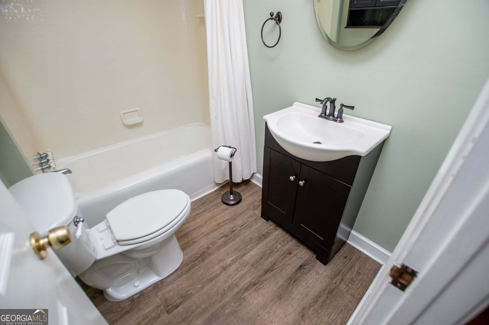 1405 Burwell Road Carrollton, GA 30117 - Photo 45 of 102 a bathroom with a sink toilet and shower
