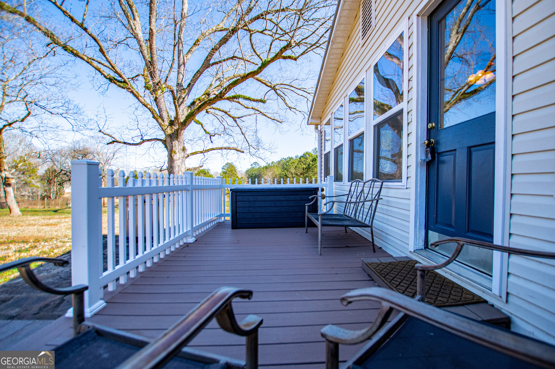 1405 Burwell Road Carrollton, GA 30117 - Photo 56 of 102 a wooden bench sitting in front of a building