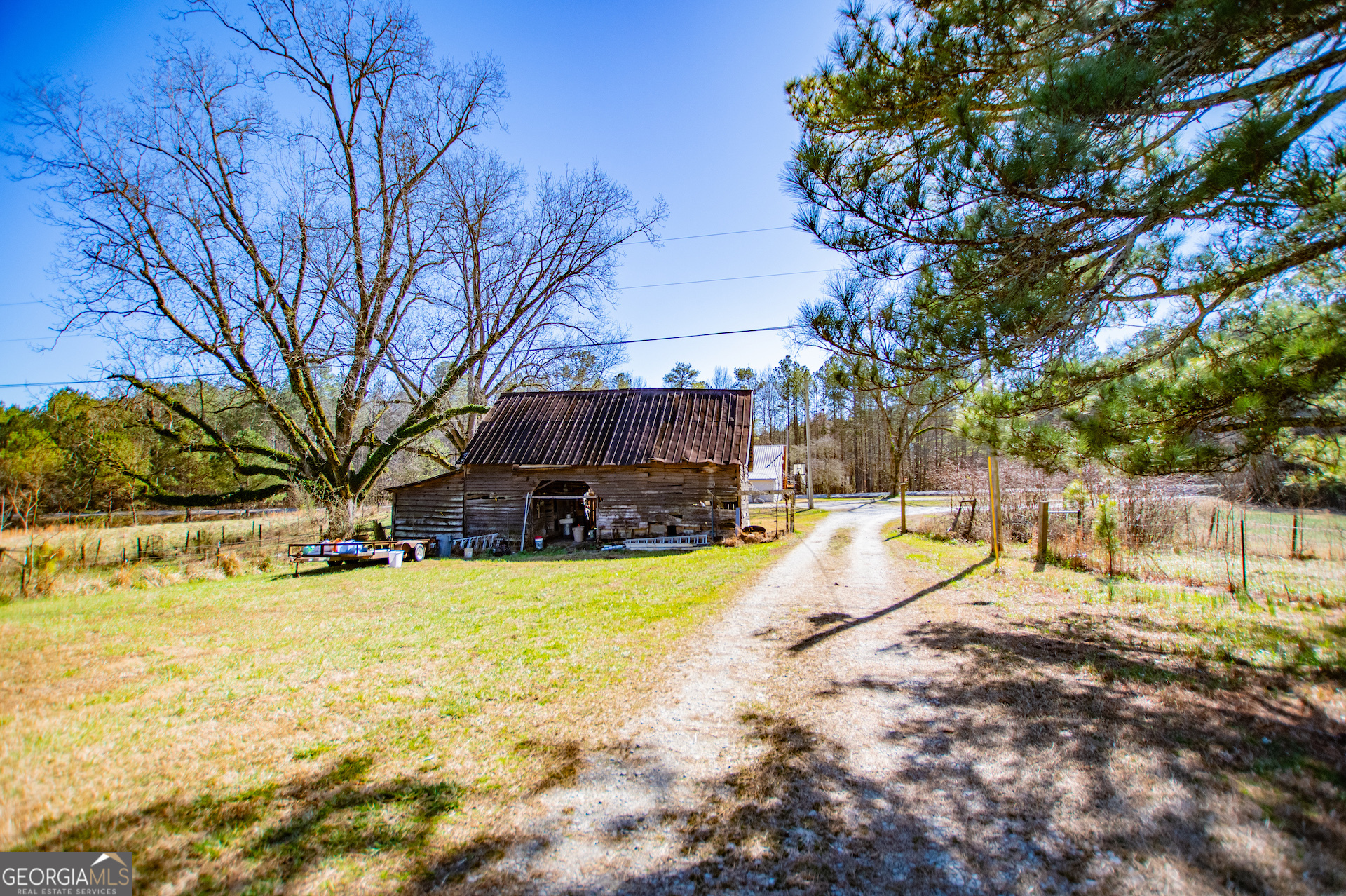 1405 Burwell Road Carrollton, GA 30117 - Photo 61 of 102 a view of a swimming pool with an outdoor space and seating area