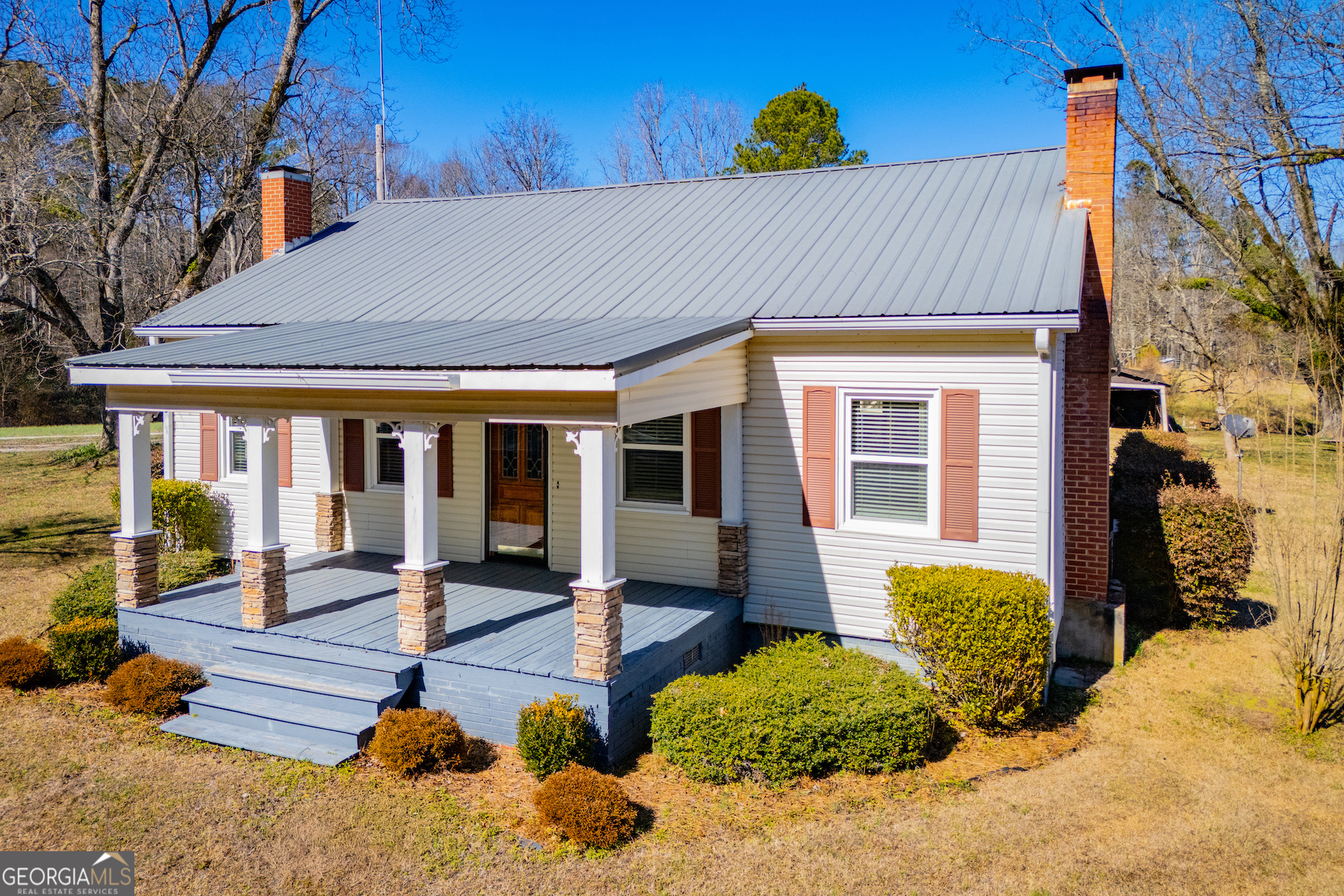 1405 Burwell Road Carrollton, GA 30117 - Photo 64 of 102 a view of a house with a yard and sitting area