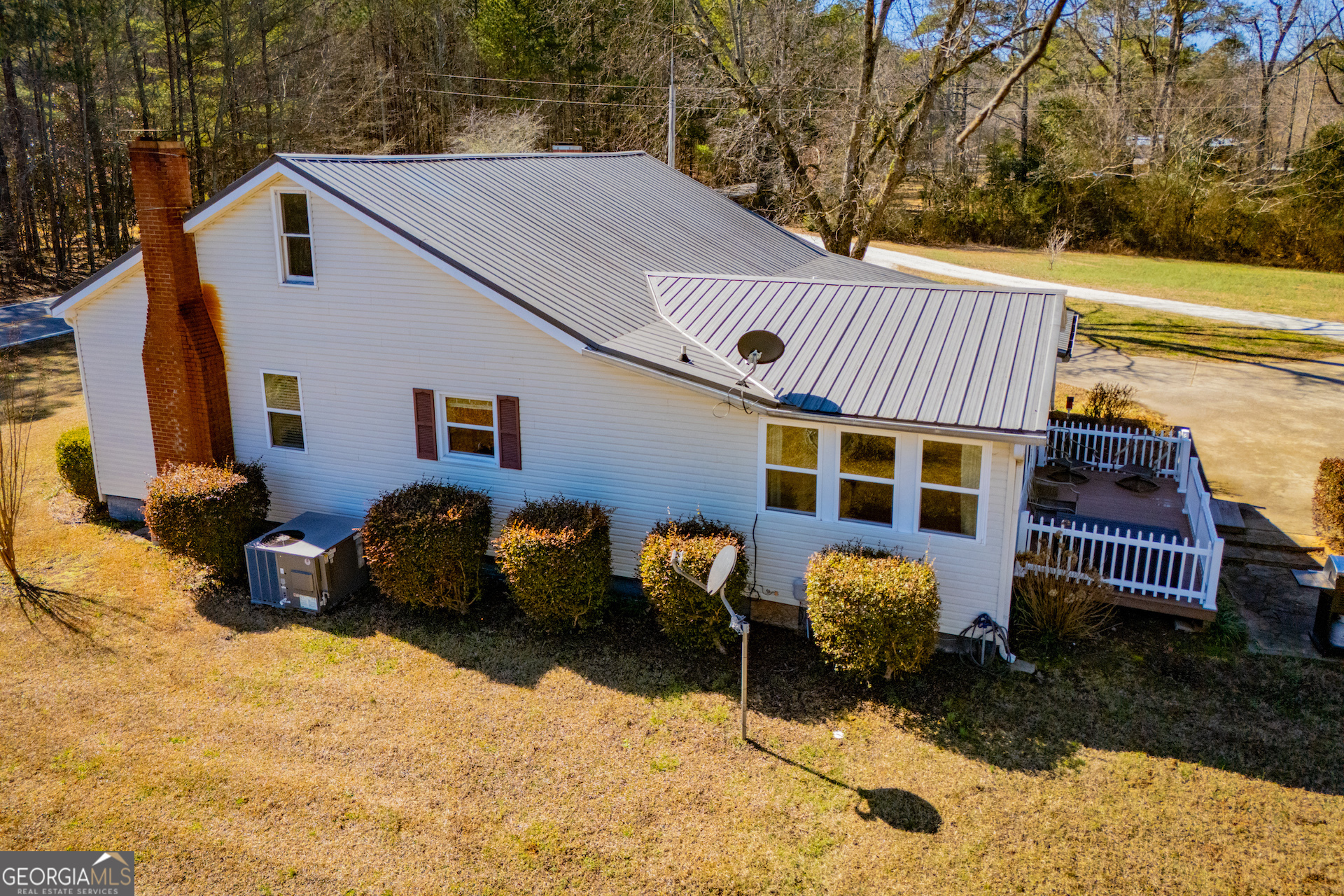 1405 Burwell Road Carrollton, GA 30117 - Photo 71 of 102 a view of a chairs and table in the back yard of the house