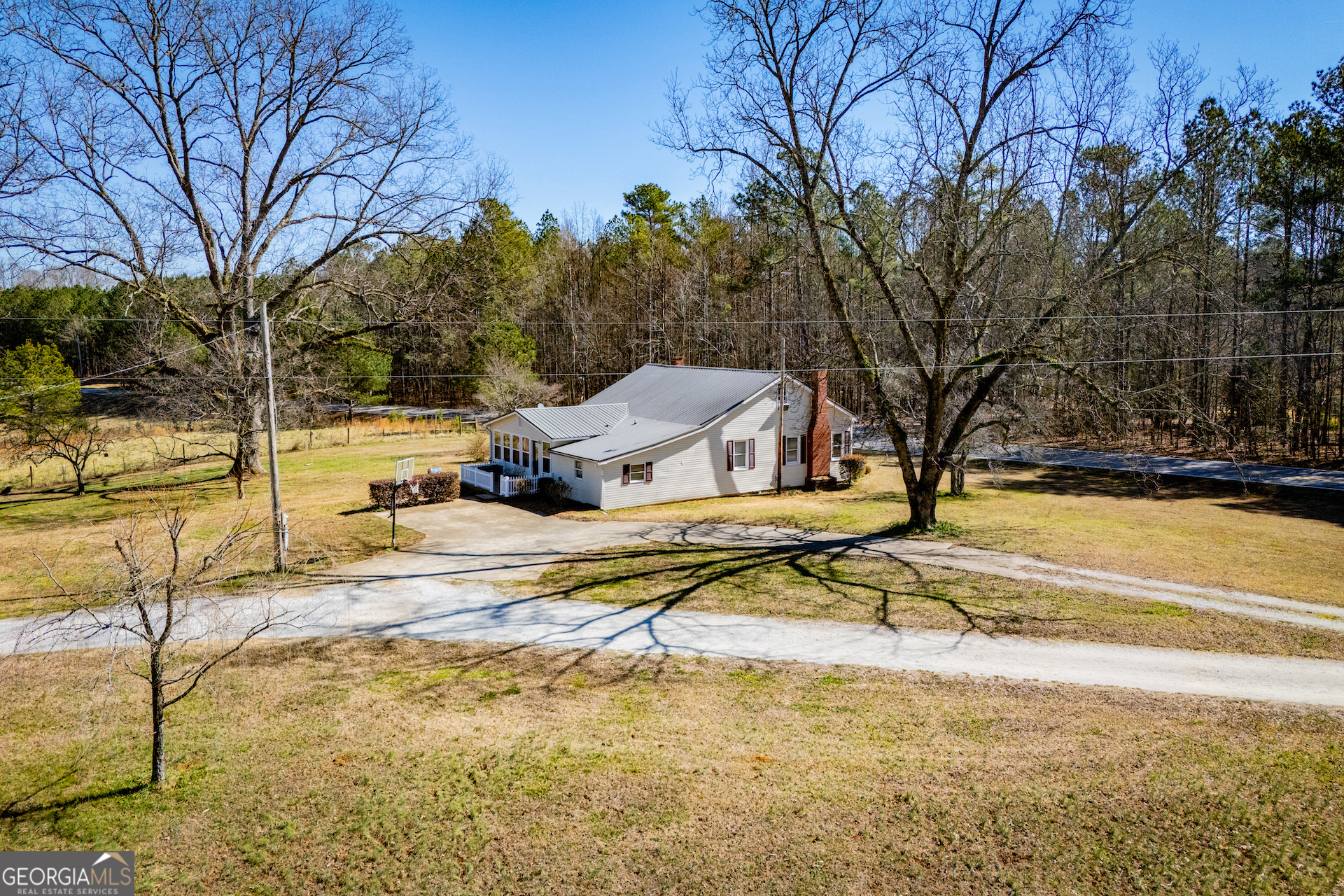 1405 Burwell Road Carrollton, GA 30117 - Photo 93 of 102 a view of a swimming pool with a house