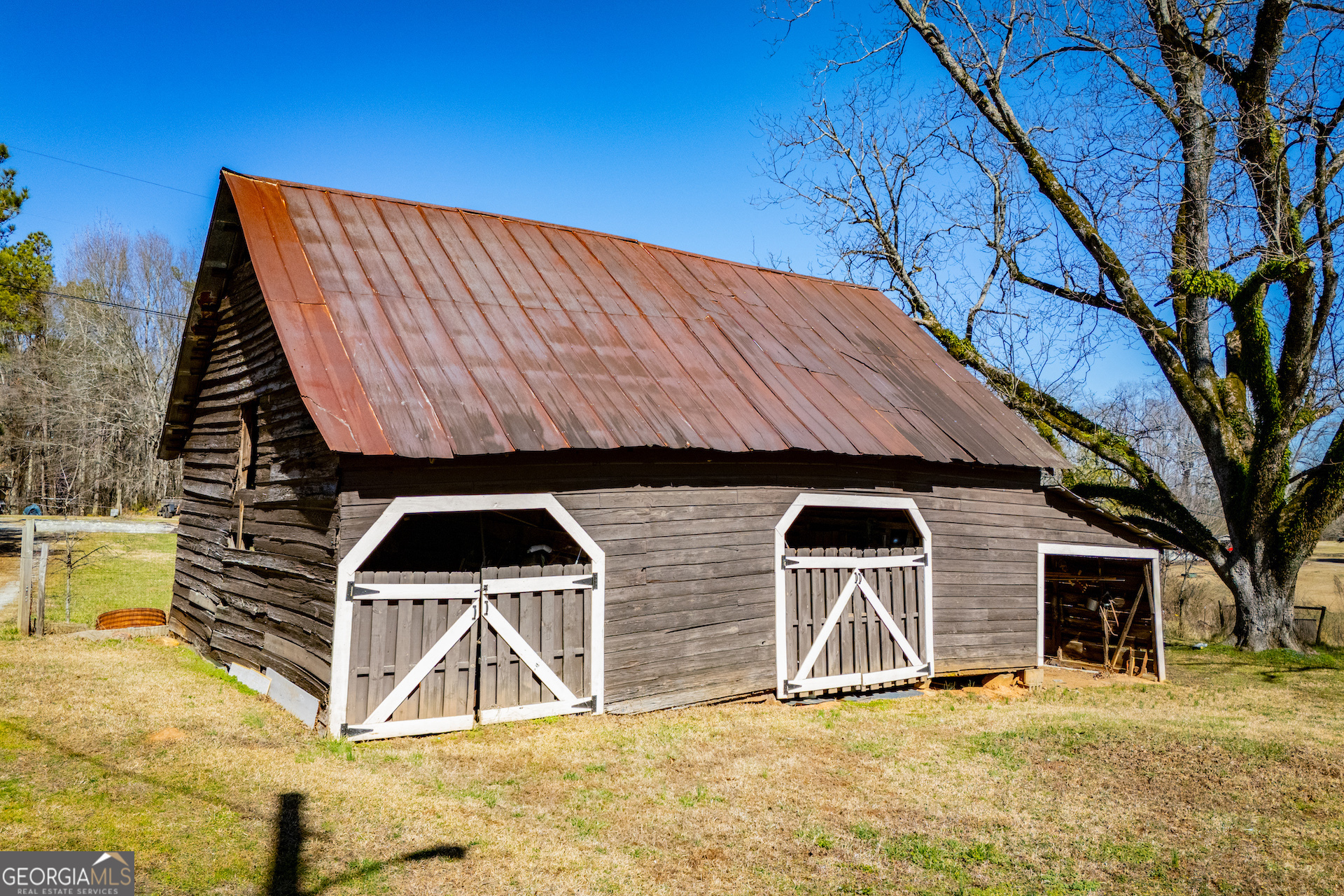 1405 Burwell Road Carrollton, GA 30117 - Photo 96 of 102 a view of a house with backyard and a tree