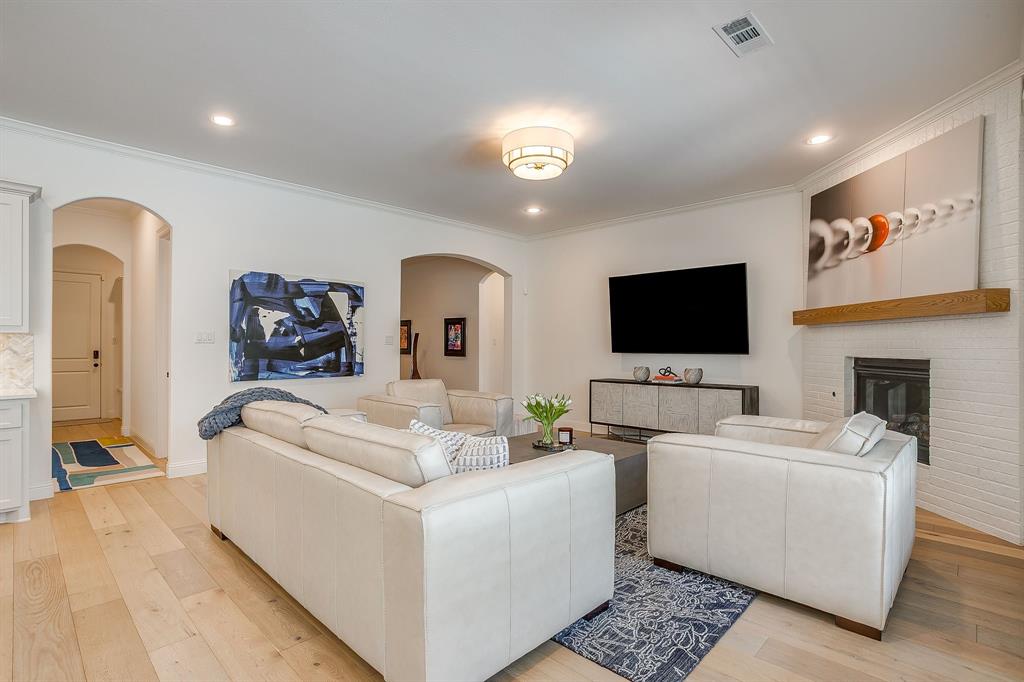 413 Kestrel Court Aledo, TX 76008 - Photo 11 of 40 a living room with furniture and a flat screen tv