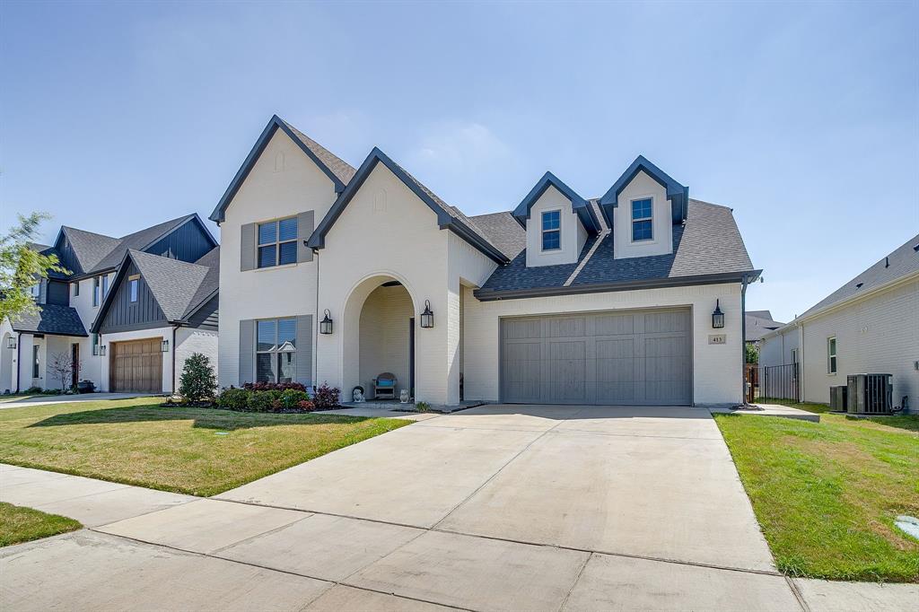 413 Kestrel Court Aledo, TX 76008 - Photo 2 of 40 a front view of a house with a yard and garage
