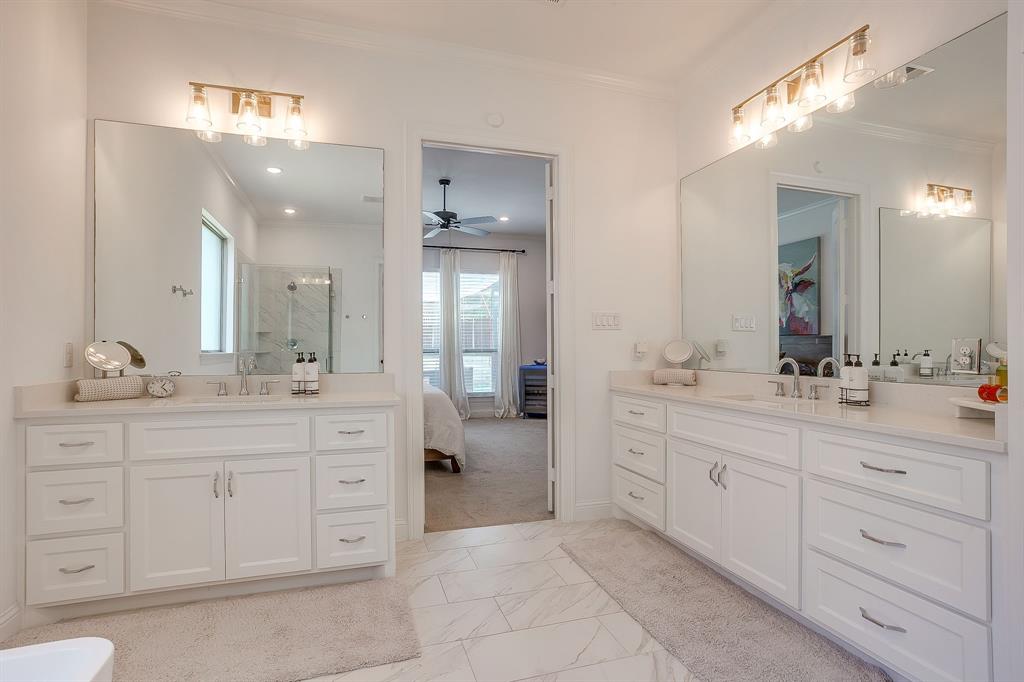413 Kestrel Court Aledo, TX 76008 - Photo 25 of 40 a spacious bathroom with a granite countertop sink a mirror a vanity and a
