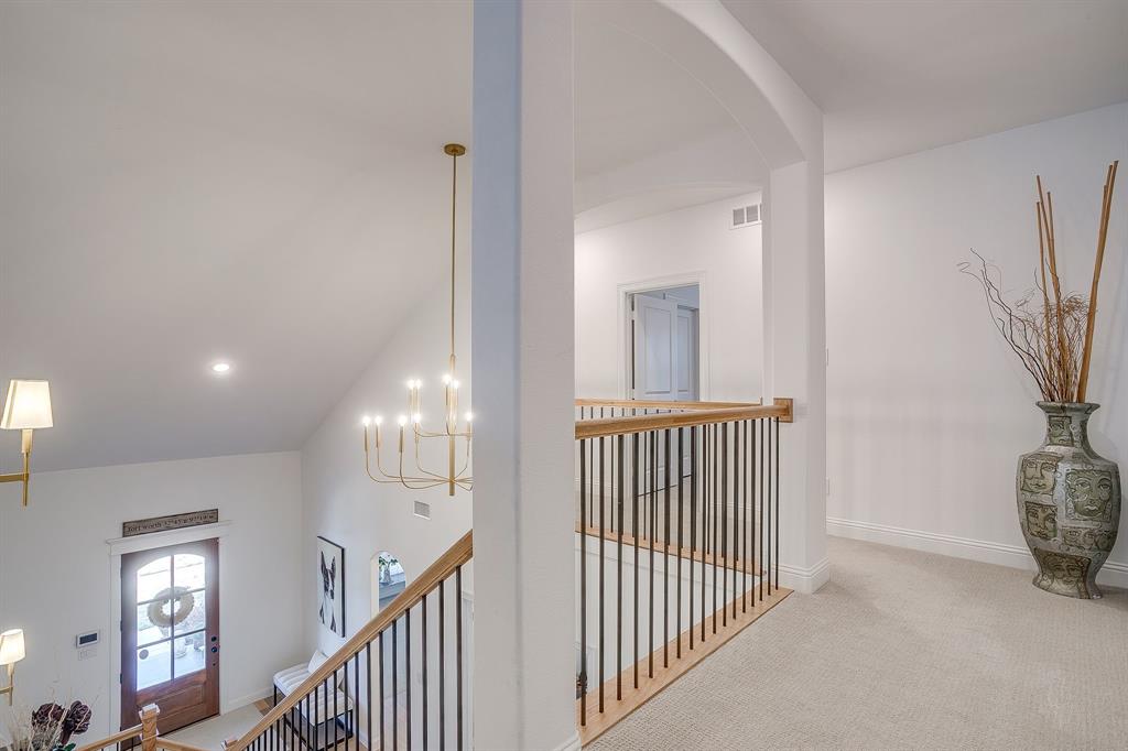 413 Kestrel Court Aledo, TX 76008 - Photo 27 of 40 a view of a hallway with windows and stairs