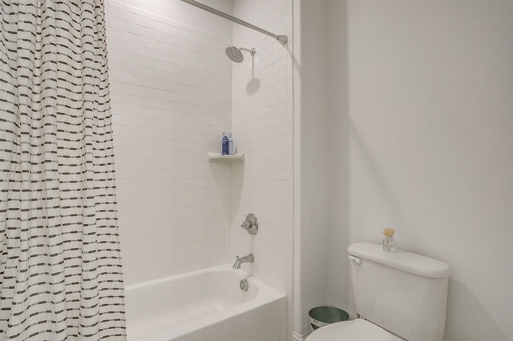 413 Kestrel Court Aledo, TX 76008 - Photo 30 of 40 a bathroom with a bathtub and a shower