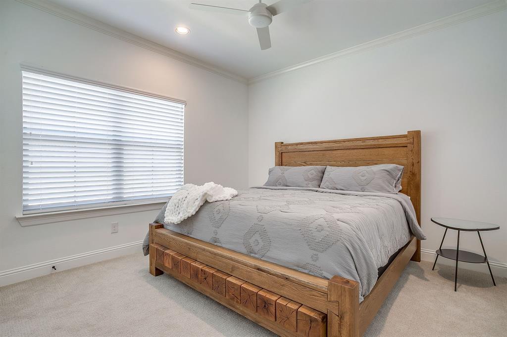 413 Kestrel Court Aledo, TX 76008 - Photo 32 of 40 a spacious bedroom with a bed and a window